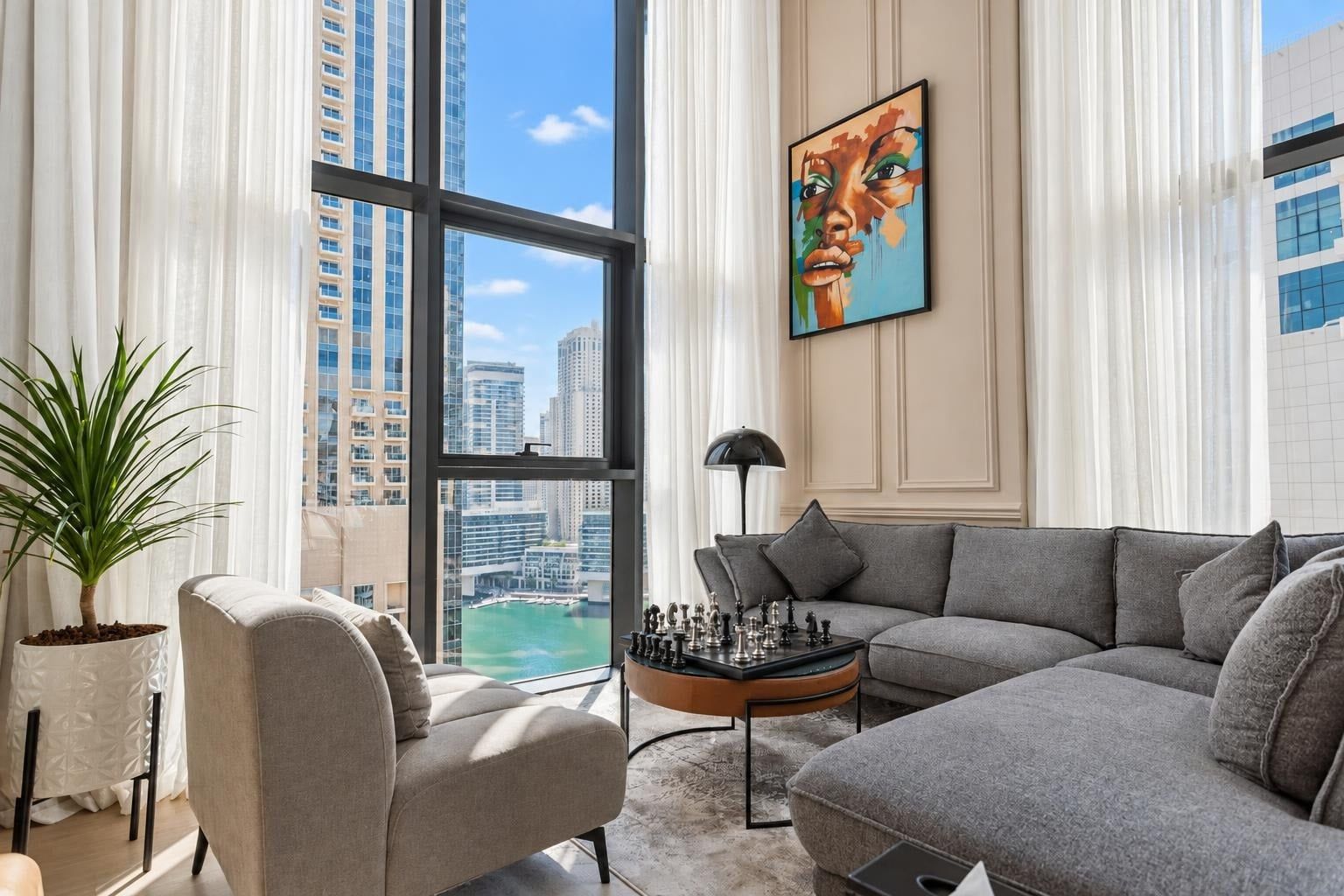 Enhanced photo: the same living room, brighter, with a blue sky and a clear view through the windows.
