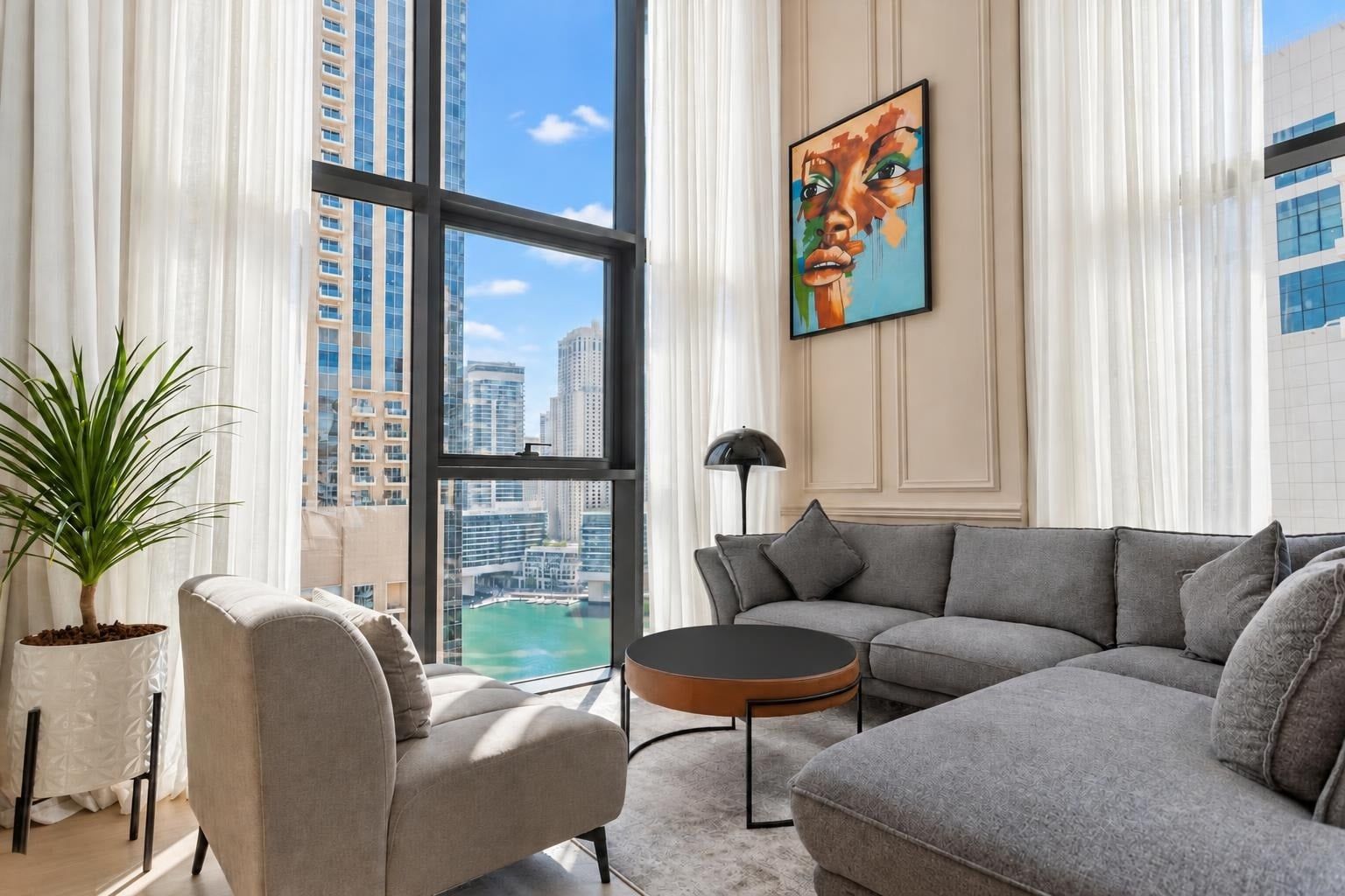 Decluttered: the same living room with a clear coffee table and sofa; furniture unchanged.